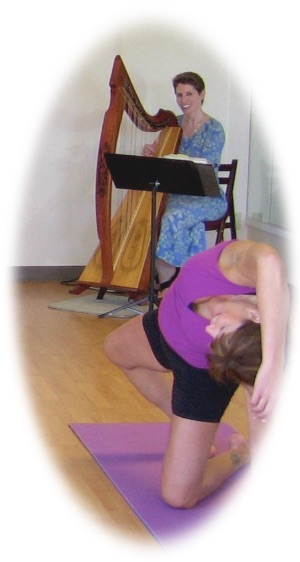 Harpist Anne Roos playing for yoga class