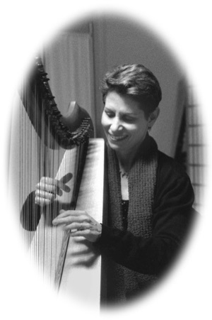 black and white photo of Anne Roos playing harp