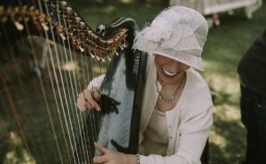 Harpist Anne Roos playing at a Cottagecore Wedding